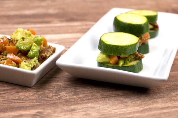 Zucchini's tower with carrots, dried tomatoes and avocado 