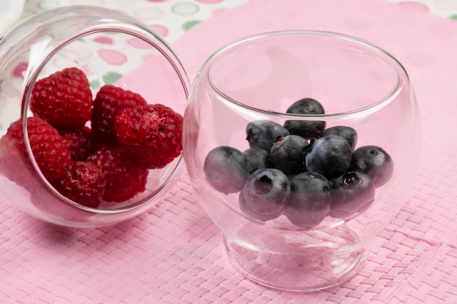  Raspberries and blueberries in a jar 